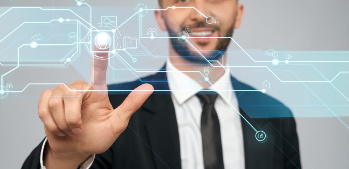 Young businessman clicking virtual button.